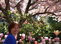 Maitri siting under a cherry tree